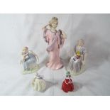 A collection of five figurines depicting