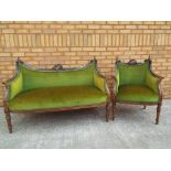 A French style highly carved settee decorated with musical instruments with matching armchair.