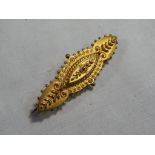 A lady's 15 carat yellow gold bar brooch, approx weight 2.