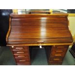 A roll top writing bureau 121 cm x 124 cm x 76 cm