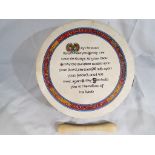 A small wooden hand drum printed with an Irish blessing