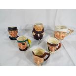A good lot to include 4 character jugs by Lancaster & Sandland including a Highway man, a Pirate,
