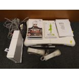 Nintendo Wii - A Nintendo Wii games consol with balance board, Nunchucks, cables,