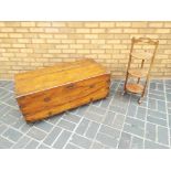 A good quality wooden chest on castors 105 cm x 52 cm x 37 cm and a good quality 3 tier wooden