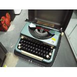 A Imperial typewriter with hard carry case