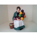 Royal Doulton - a figurine depicting The Old Balloon Seller HN1315,