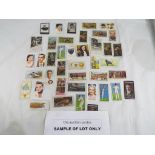 A large quantity of cigarette cards to include cards by Ogdens Army Club cigarettes,