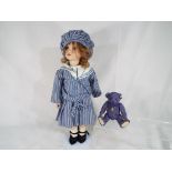 A good quality ceramic dressed doll with glass eyes on a modern stand and a ceramic Steiff original