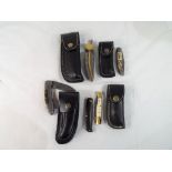 A collection of five knives comprising a Perkin all Damascus steel folding knife in leather pouch /
