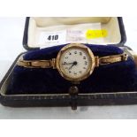 A lady's yellow metal expandable wrist watch with 9ct gold back, boxed.