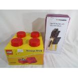 Unused retail stock - a Lego storage brick size 25 cm x 25 cm x 18 cm and a Prima kitchenware 13
