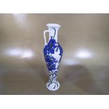 Moorcroft - a Moorcroft jug decorated in the Delphinium pattern, approximate height 32 cm (h).