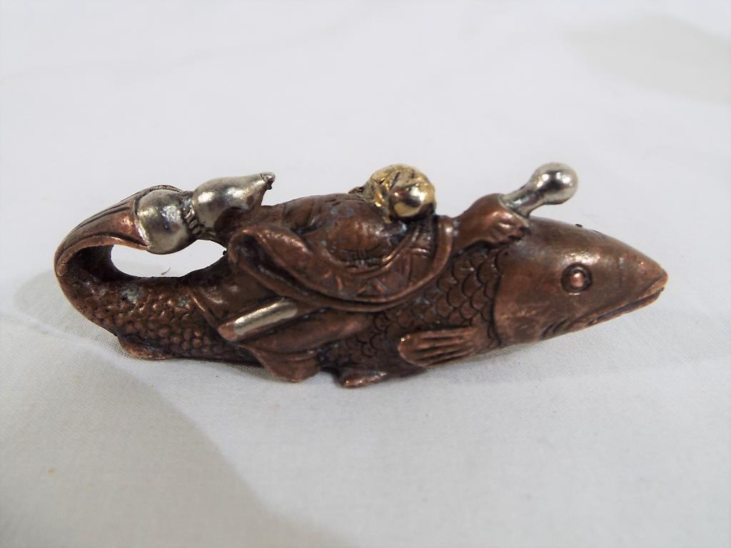 An Oriental bronze figure depicting a fish God 3 cm x 7.5 cm. - Image 2 of 3