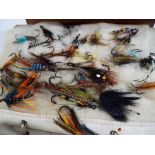 Angling - a brown leather folder containing a collection of approximately 100 fishing flies