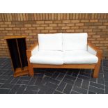 A good quality modern pine framed Ikea 2 seater sofa 74 cm x 130 cm x 84 cm and a pine CD rack 75