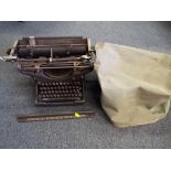 A vintage Underwood typewriter with cover