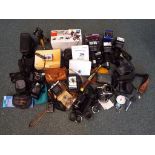 A large quantity of photography equipment to include cameras, a Canon Minolta, a Nettar and other,