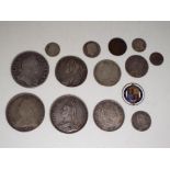 A small collection of silver coins to include George II half crown 1745, George III shilling 1787,
