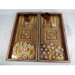 A good quality wooden inlaid backgammon set