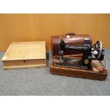 A cased Singer sewing machine and a pine writing slope (2)