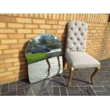 An upholstered button back dressing-table chair and a bevel edged mirror (2)