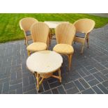 A good quality and tidy Lloyd Loom table with four chairs and matching coffee table (qty)