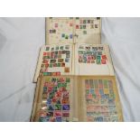 3 stamp albums containing UK and Worldwide stamps,