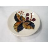 Moorcroft Pottery - a pin dish decorated with blackberries,