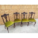 A set of 4 Victorian mahogany carved back dining/parlour chairs.