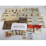 A large quantity of cigarette cards to include Wills cigarettes, Players,