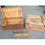 Two vintage wooden delivery crates, one from Moussec and the other from Teacher's Whisky,