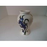Moorcroft Pottery - a small modern baluster vase decorated with bluebells,