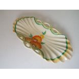 Clarice Cliff - an oval shallow Honeyglaze dish hand painted in a floral design, 23.