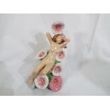 Carlton ware - A figurine of a lady entitled "The Carlton ware girl HollyHocks"