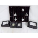 Thirteen silver plated pocket watches from the Heritage collection with display stand