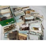 A lot containing in excess of 600 early - mid period UK topographical postcards to include real