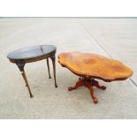A reproduction Italian coffee table and a 1940's oval occasional table.