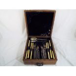An oak cased canteen of cutlery dated 1920.