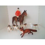 Beswick Pottery - a fox hunting set comprising Huntsman on horse,