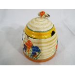 Clarice Cliff - A honey pot from the Bizarre range decorated in the Crocus pattern.