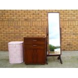 A mahogany freestanding cheval mirror approx. 138 cm high, a 1920's storage cabinet approx.