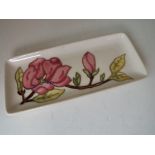 Moorcroft Pottery - a rectangular pen tray decorated with pink magnolia on an ivorine ground, 20.