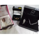 A Philip Mercer jewellery set, a Anaii pink watch and a further lady's watch by Infinite,
