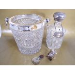 A very heavy good quality cut glass ice bucket with twin handles and white metal mount,