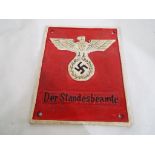 A cast iron sign with a German swastika symbol, approximate size 20 cm x 16 cm.