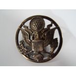 A vintage American silvered military cap badge, 4.