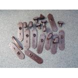 A quantity of bakelite door handles and similar
