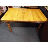 A good quality pine dining table with six chairs