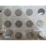 A coin collection in folder to include 121 coins,