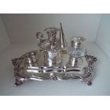 A William IV hallmarked silver desk set stand with candle holder and snuffer,